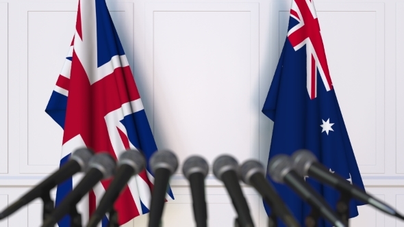 Flags of the United Kingdom and Australia at International Press Conference alt