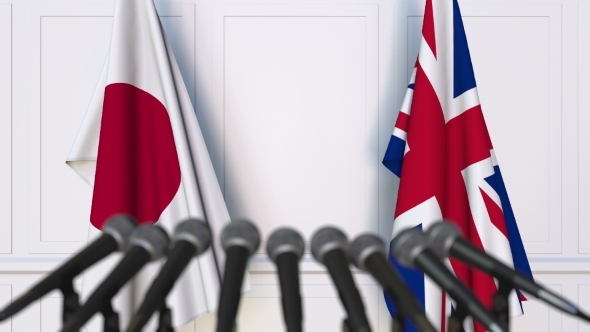 Flags of Japan and The United Kingdom at International Press Conference alt