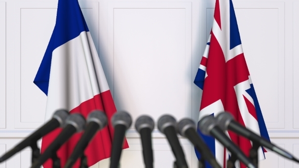 Flags of France and The United Kingdom at International Press Conference alt