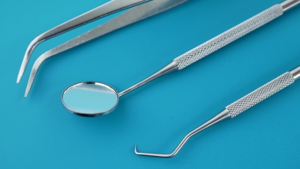 Set of Dentist Tools on Green Background