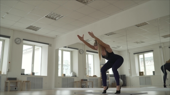 The Girl Is Engaged in Pilates. The Girl Is Engaged in Sports in the Gym.