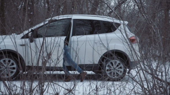 Man Getting Into Car and Leaving