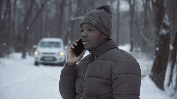 Man Talking with Helpline Having Broken Car