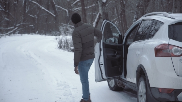 Man Having Car Problem on Remote Road