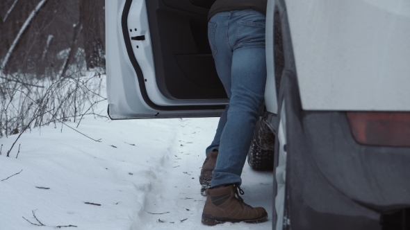 Man Pushing Car Trying To Start Engine