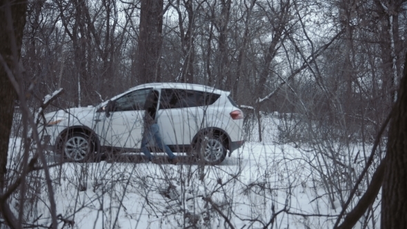 Man Getting Into Car and Leaving