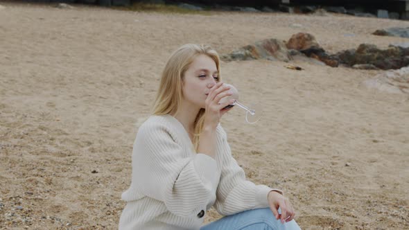 Pretty Blonde Lady Is Relaxing On Beach