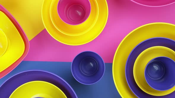 Pink Blue Yellow Colorful Plastic Water Bowls Futuristic Color Design.  Footage