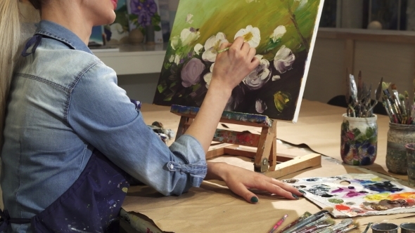 Cropped Shot of a Smiling Female Artist Drawing Flowers at Her Art Studio