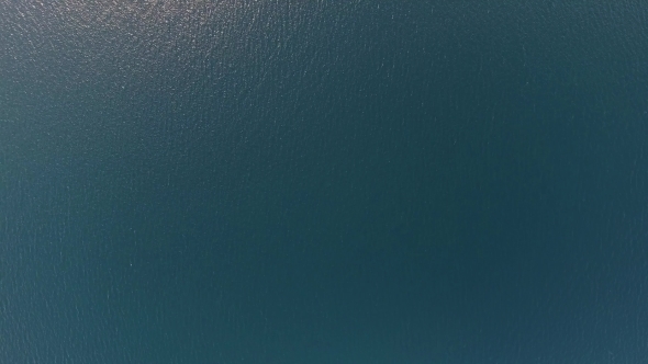 Flying Over Blue Sea Water Surface