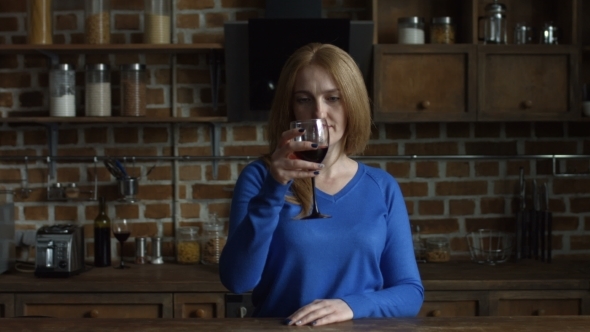 Gorgeous Middle Aged Woman Enjoying Red Wine