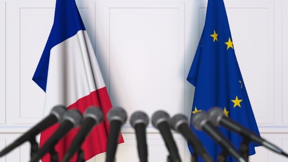 Flags of France and the European Union at International Press Conference alt
