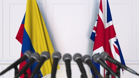 Flags of Colombia and The United Kingdom at International Press Conference alt