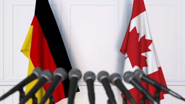 Flags of Germany and Canada at International Press Conference alt
