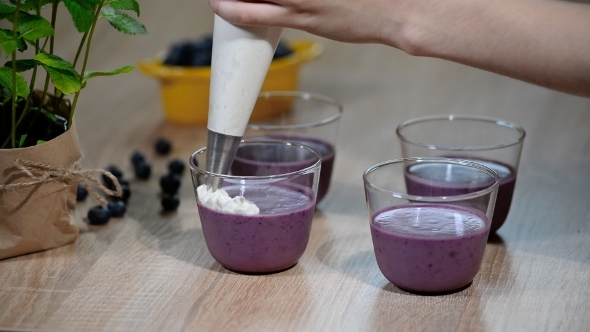 Decorate the Panna Cotta with Whipped Cream. Squeeze the Cream with a Pastry Bag