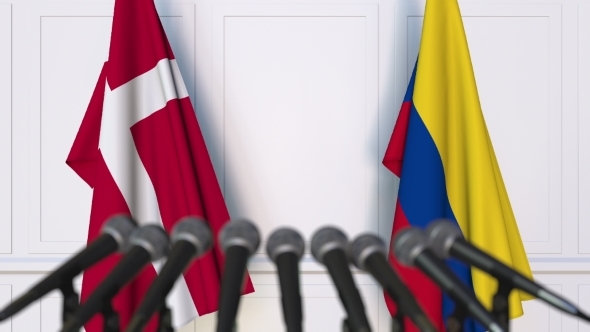 Flags of Denmark and Colombia at International Press Conference alt