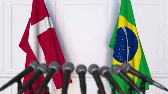 Flags of Denmark and Brazil at International Press Conference alt