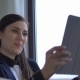 Young Attractive Woman Calls Her Family Via Tablet and Skype From Work. - VideoHive Item for Sale