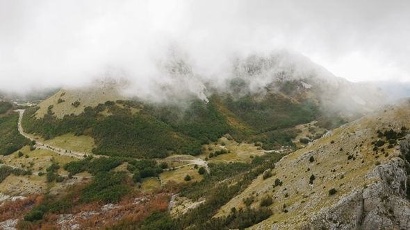 Mountain View with Thick Clouds Down To the Lowland