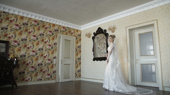 Beautiful Bride Poses and Smiles at Camera in the Luxurious Apartments