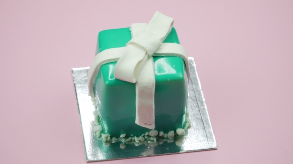 Bright and Colorful Cake Gift  on a Pink Background