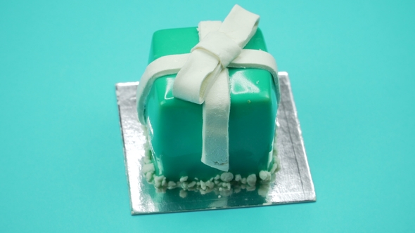 Bright and Colorful Cake Gift  on a Blue Background