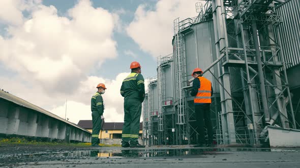 Engineers Inspecting Grain Storage Elevators