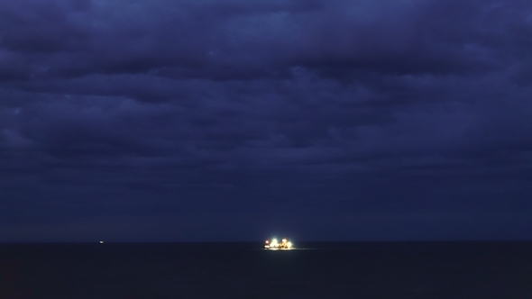 . Night in Ocean and Storm Clouds, Fishing Ships in the Distance.
