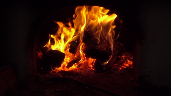 Fire Flames in Fireplace. Bonfire and Coals