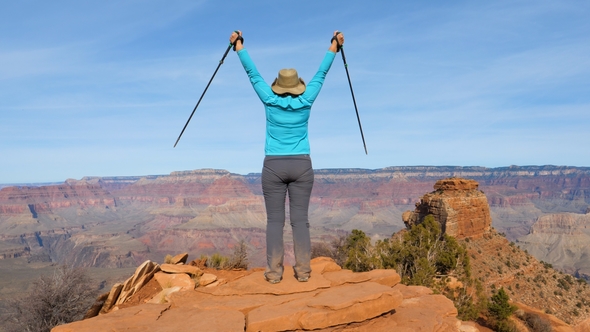 Woman Hiking In Grand Canyon Is Coming To The Observation Point And Arms Up