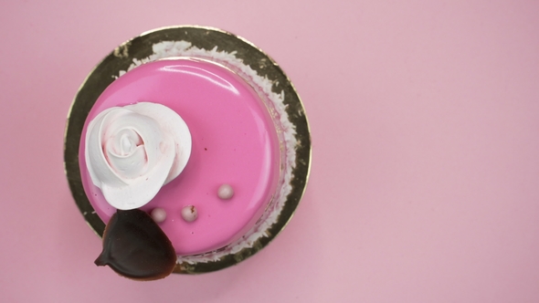 Bright and Colorful Cake  on a Pink Background