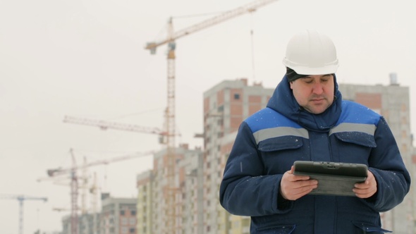 Foreman With Pad at Major Construction Project