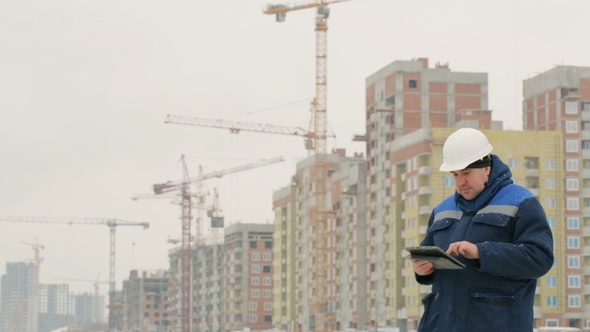 Foreman With Pad at Major Construction Project