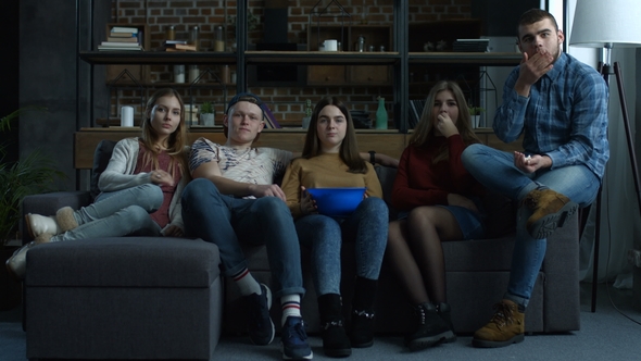 Group of Teenagers Watch Comdey Movie with Popcorn