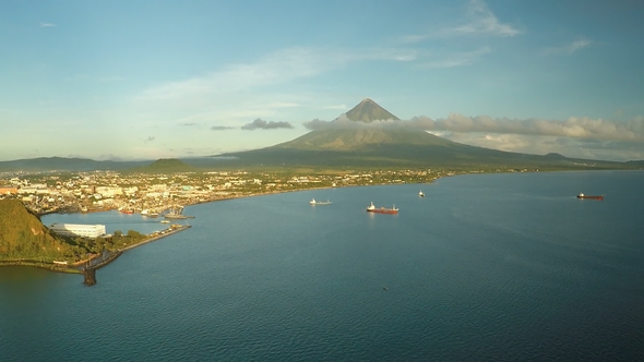 Aerial Panorama of the City of Legaspi in the Morning at Dawn. Against the Backdrop of the Mayon