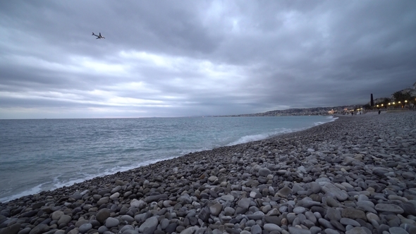 Evening on Nice Promenade Anglais with Sea and Waves on Mediterranean Sea