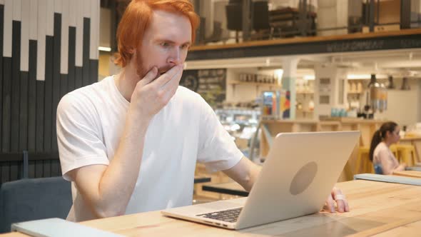 Astonished, Amazed Redhead Beard Man Working in Cafe