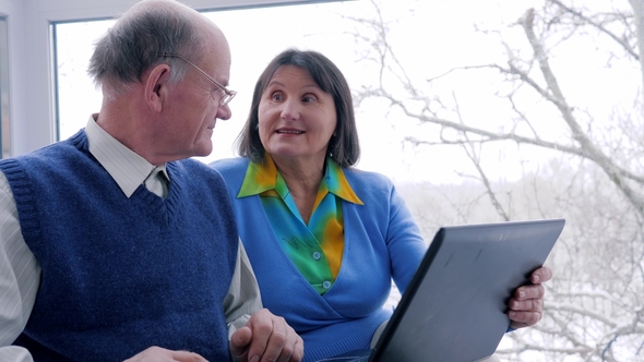 Good Buy, Old Couple with Plastic Card and Laptop Make Online Payment