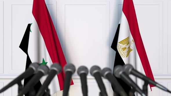 Flags of Syria and Egypt at International Press Conference alt