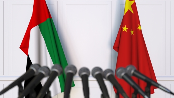 Flags of the UAE and China at International Press Conference alt