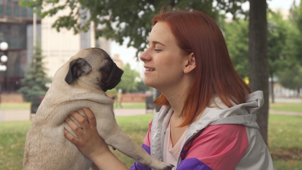 Girl Kissing Her Pug