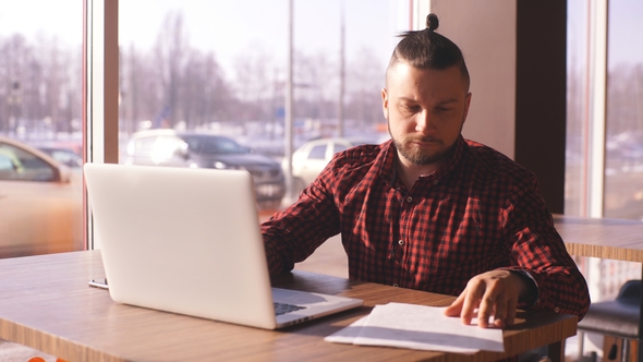 Businessman Working, Businessman in Cafe, Businessman Looking at Documents