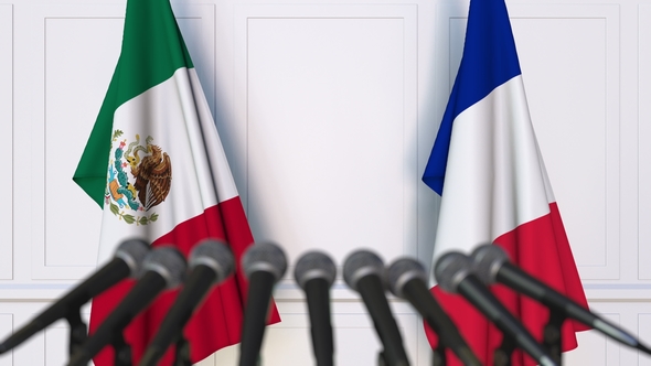 Flags of Mexico and France at International Press Conference alt