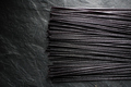 Black dry rice noodles on black stone free space - PhotoDune Item for Sale