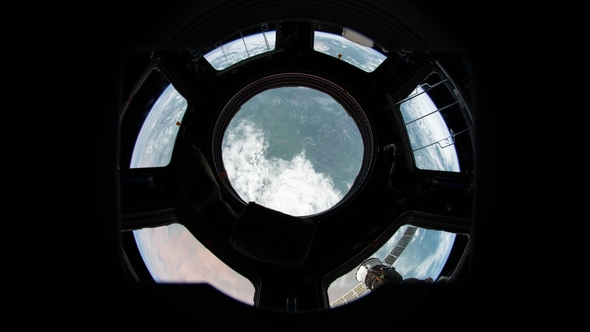 Earth Through Window of International Space Station