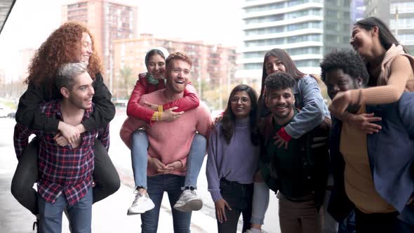 Diverse people having fun together outdoor in the city - Happy youth friendship