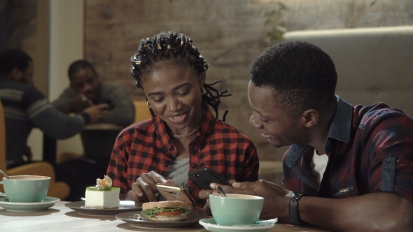 Attractive Young Black Couple in a Cafeteria