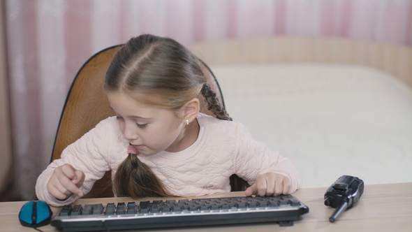 Girl Is Sitting at the Table