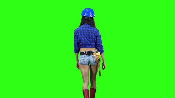 Rear View of Girl Wearing Helmet and Shorts Walking