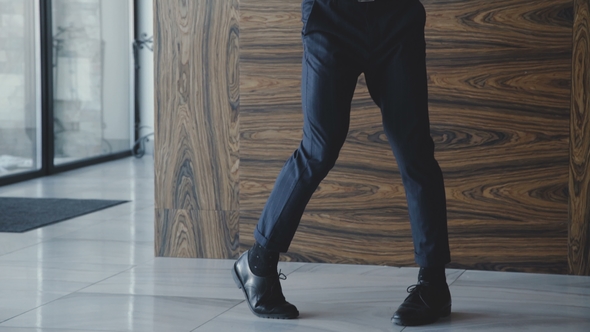 Glamorous Young Man in Stylish Suit Dancing in the Room